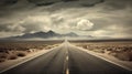 Straight country road with mountains on horizon Royalty Free Stock Photo