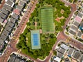 Straight down drone shot of empty mini soccer field and tenis court