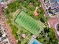 Straight down drone shot of empty mini soccer field and tenis court