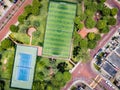 Straight down drone shot of empty mini soccer field and tenis court Royalty Free Stock Photo