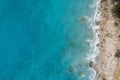 Straight down view on waves on rocky shore by Bunec Beach area in Summer 2022, Albania. Royalty Free Stock Photo