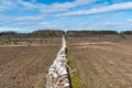 Straight dry stone wall boundry Royalty Free Stock Photo