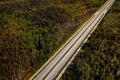 Straight empty highway through deep forest aerial view Royalty Free Stock Photo