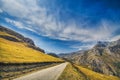 Straight empty highway leading into Xinalig village. Beautiful landscape of big Caucasus mountains and road country road with blue Royalty Free Stock Photo