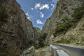 Straight empty highway leading into Xinalig village. Beautiful landscape of big Caucasus mountains and road country road with blue Royalty Free Stock Photo