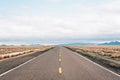 Straight, flat road in the desert of New Mexico Royalty Free Stock Photo