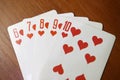 Straight flush combination of cards in poker. Card diamonds on wooden table. concept of gambling. Loss or win-win. Royalty Free Stock Photo