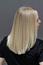 Straight hair after bleaching process. Look from behind. Hair care concept Royalty Free Stock Photo