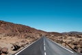 Straight highway road through desert, mountain landscape Royalty Free Stock Photo
