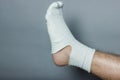 Straight leg with a big hole in the sock Royalty Free Stock Photo