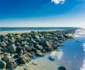 Straight line of stacked rocks on the beach with a ocean view Royalty Free Stock Photo