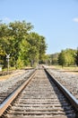 Straight railroad tracks disappearing in the distance Royalty Free Stock Photo