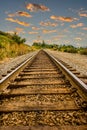 Straight Railroad Tracks at Dusk Royalty Free Stock Photo