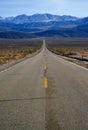 Straight Road in the California desert, going into the mountains near Death Valley National Park Royalty Free Stock Photo