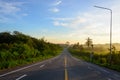 Straight road and colorful sunset