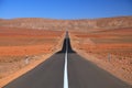 Straight road in the desert Royalty Free Stock Photo
