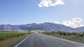 Straight road in New Zealand scenic highway. Royalty Free Stock Photo