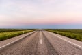 straight road through the outback of Australia, after a beautiful sunset, Nothern territory Royalty Free Stock Photo