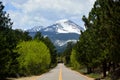 A Straight Road Pointing to Snow Covered Copeland Mountain in Rocky Mountain National Park