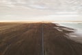 Straight road by the salt lake with wide flatlands background Royalty Free Stock Photo