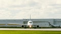 Straight shot of a commercial plane on runway at Fort Lauderdale International Airport in Florida