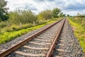 Straight single track rails seemingly endless Royalty Free Stock Photo