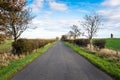 Deserted country road and blue sky Royalty Free Stock Photo