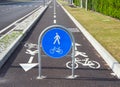 Straight two way cycle lane with traffic street signs. Royalty Free Stock Photo