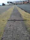 straight yellow lines at apron as marking area