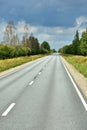 Straightway road on sunny summer day in Latvia Royalty Free Stock Photo