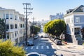 Straiht tree lined thoroughfare in a residential distric of San Francisco on a sunny autumn day Royalty Free Stock Photo