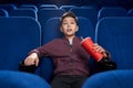 Strained boy watching horror movie in cinema Royalty Free Stock Photo