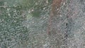 Strained glass broken window from explosion splinter. Shattered glass. Abstract blurred defocused broken glass texture