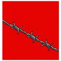A strand of barbed wire stretches diagonally across a bright red background. The wire Royalty Free Stock Photo