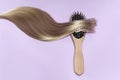 Strand of hair on a wooden comb Royalty Free Stock Photo