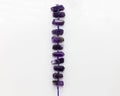 Strand of large irregular shaped purple beads Royalty Free Stock Photo