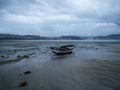 Stranded beached fishing boat vessle ship on coastline shore of seaside town village Combarro Galicia Spain at low tide Royalty Free Stock Photo