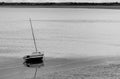 Stranded Boat in the sea of Cancale Town in Normandy in Northern France during very low tide Royalty Free Stock Photo