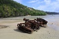 Stranded car wreckage on sandy beach Royalty Free Stock Photo