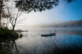 Stranded. a swimming dock sits in still foggy water on a Northern Ontario lake. Royalty Free Stock Photo