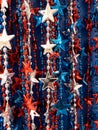 Strands of red,white & blue beads,stars, great background for July 4th Royalty Free Stock Photo