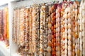 Strands of semiprecious stones on display in bijouterie store