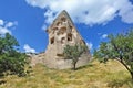 A strange ancient rock of Cappadocia against the backdrop of a bright blue sky Royalty Free Stock Photo