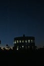 Strange arbor under the starry sky on the field Royalty Free Stock Photo