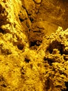 Strange and beautiful yellow pattern of stone texture of Ali Sadr cave walls, Hamedan, Iran