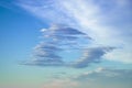 Strange cloud shaped like a ring. Blue sky with fluffy clouds as a natural background
