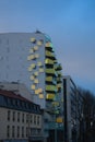 Strange glass building facade in green yellow in Paris France