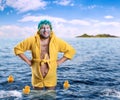 Strange man with face pack stands in water Royalty Free Stock Photo