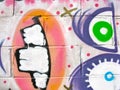 Strange, painted face on a cement block background Royalty Free Stock Photo