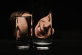 portrait of a smiling man looking through two glasses Royalty Free Stock Photo